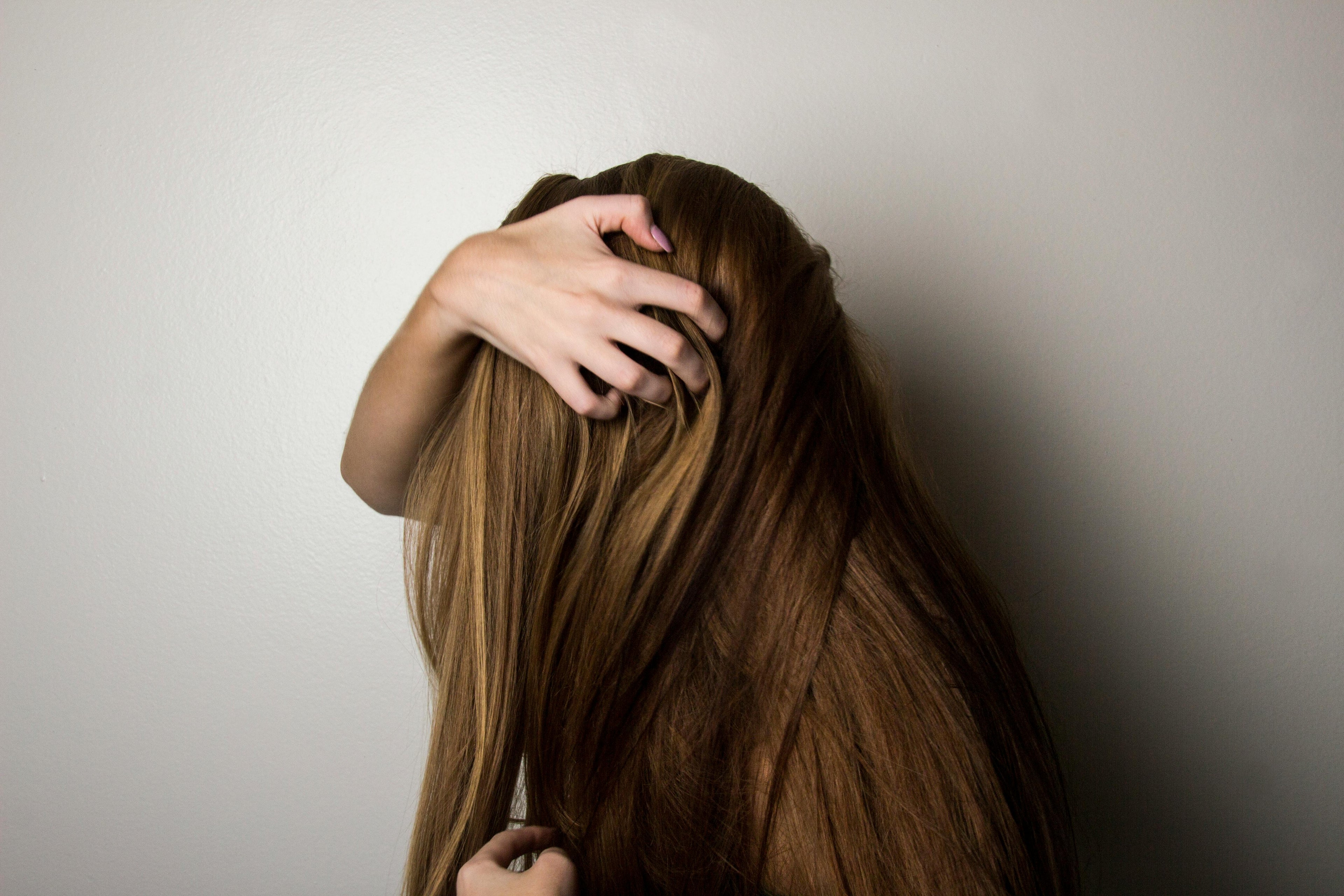 A girl holding her hair