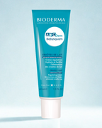 Bioderma ABCDerm Babysquam tube on a light blue background