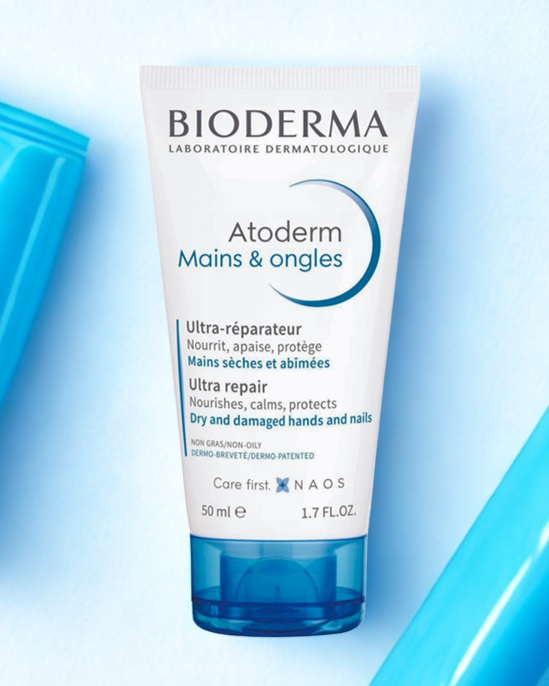 Bioderma Atoderm Mains & Ongles cream tube on a light blue background