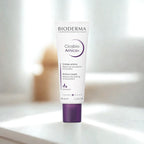Bioderma Cicabio Arnica+ cream tube on a blurred background