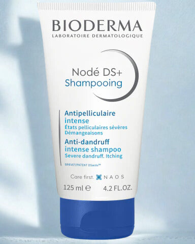 Bioderma Nédé DS+ Shampooing tube on a light blue background
