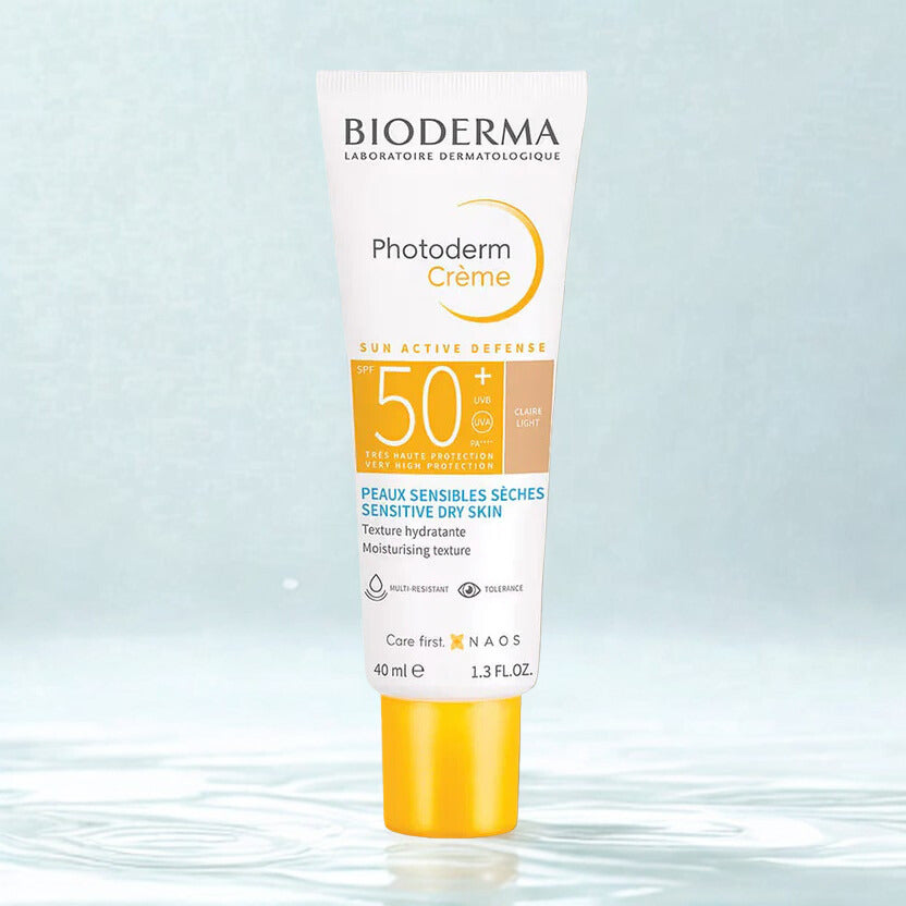 Bioderma Photoderm Crème sun cream bottle on a light blue background