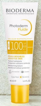 Bioderma Photoderm Fluide sunscreen tube on a light background