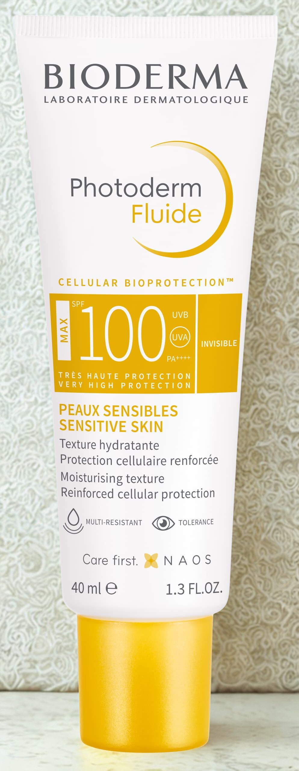 Bioderma Photoderm Fluide sunscreen tube on a light background