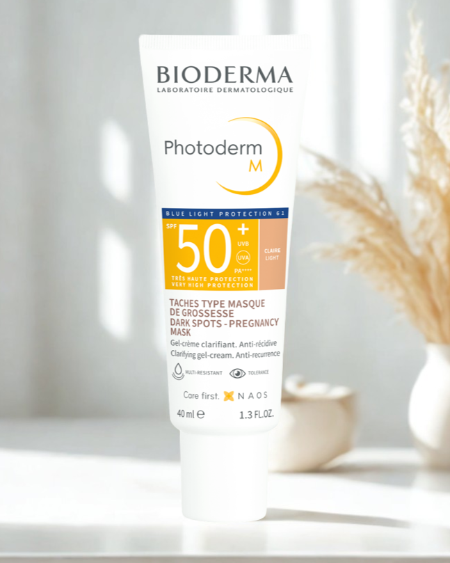 Bioderma Photoderm M sunscreen tube on a white surface with a blurred background