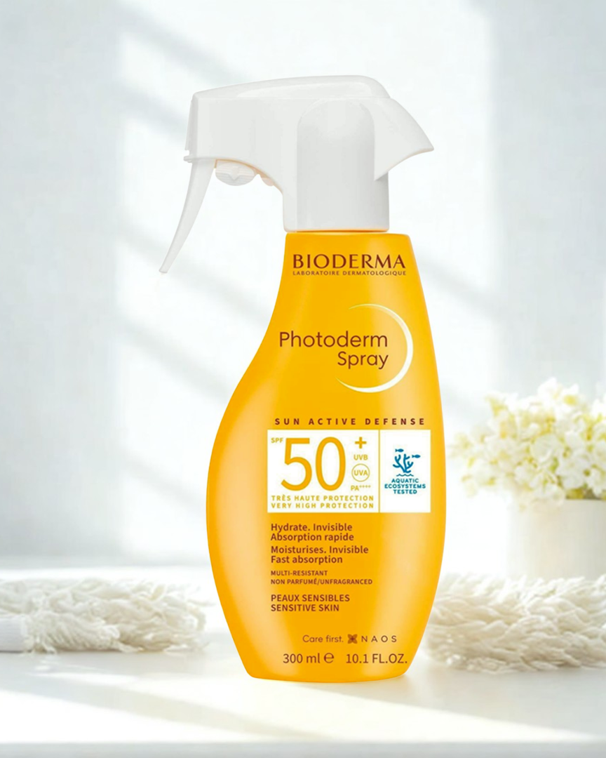 Bioderma Photoderm spray bottle on a white background