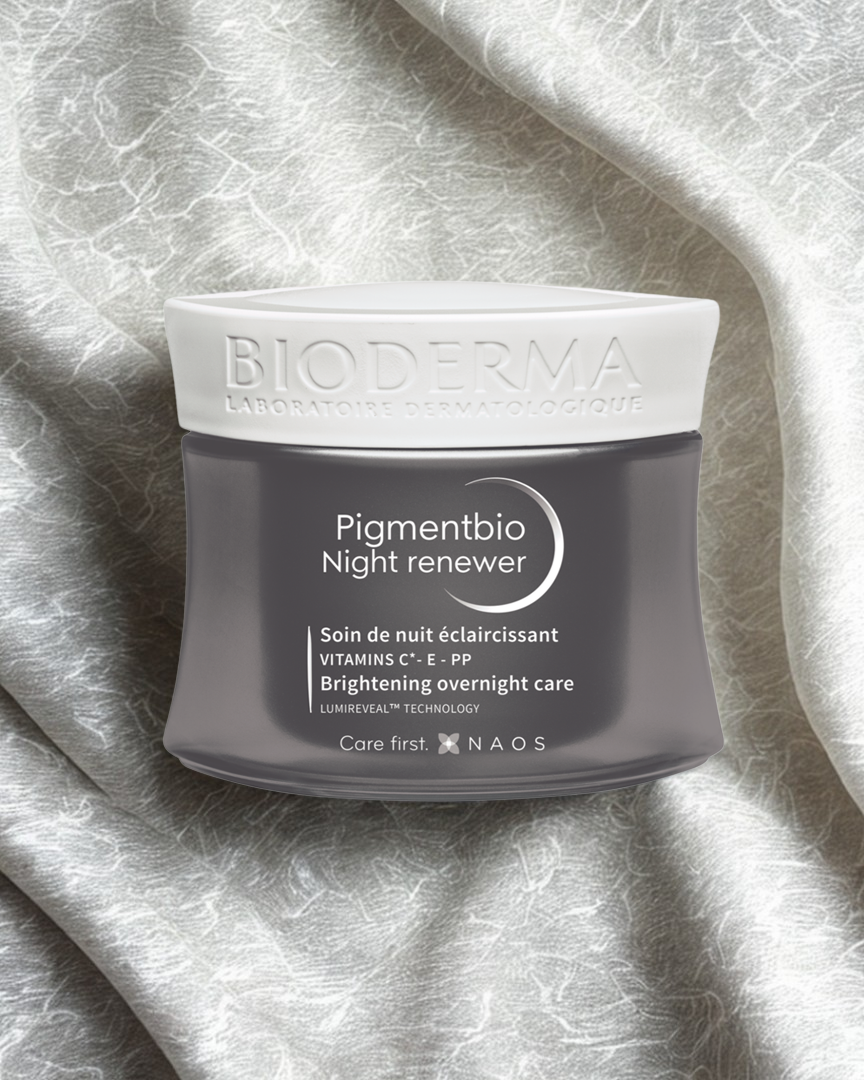 Bioderma Pigmentbio Night Renewer jar on a textured gray background
