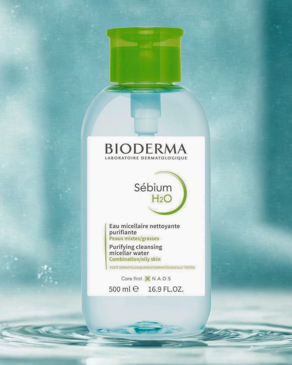 Bioderma Sébium H2O bottle with a green cap on a water background