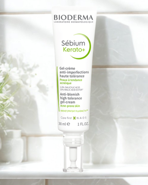 Bioderma Sébium Kerato+ skincare product on a white surface with a blurred background