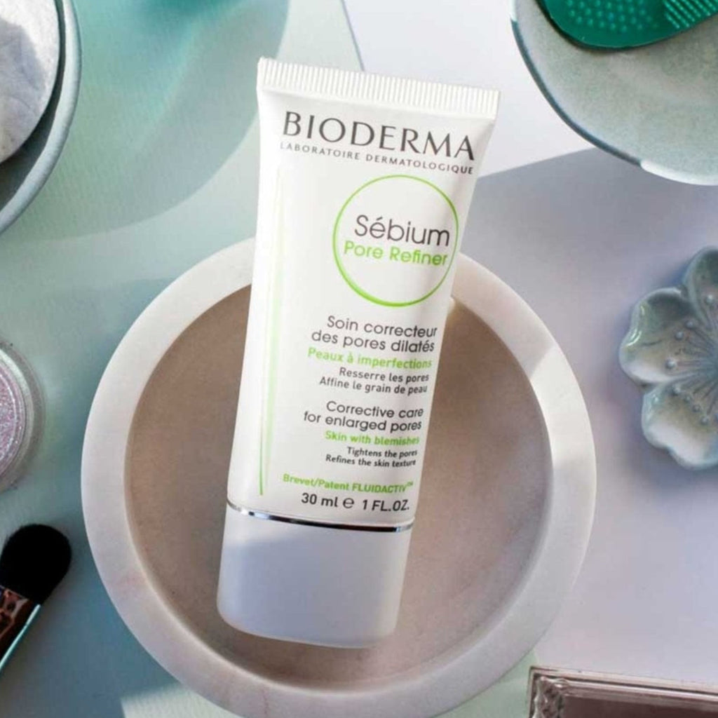 Bioderma skincare product on a table with makeup items