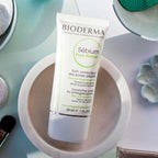 Bioderma skincare product on a table with makeup items