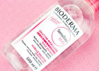 Bioderma Sensibio H2O bottle on a pink background