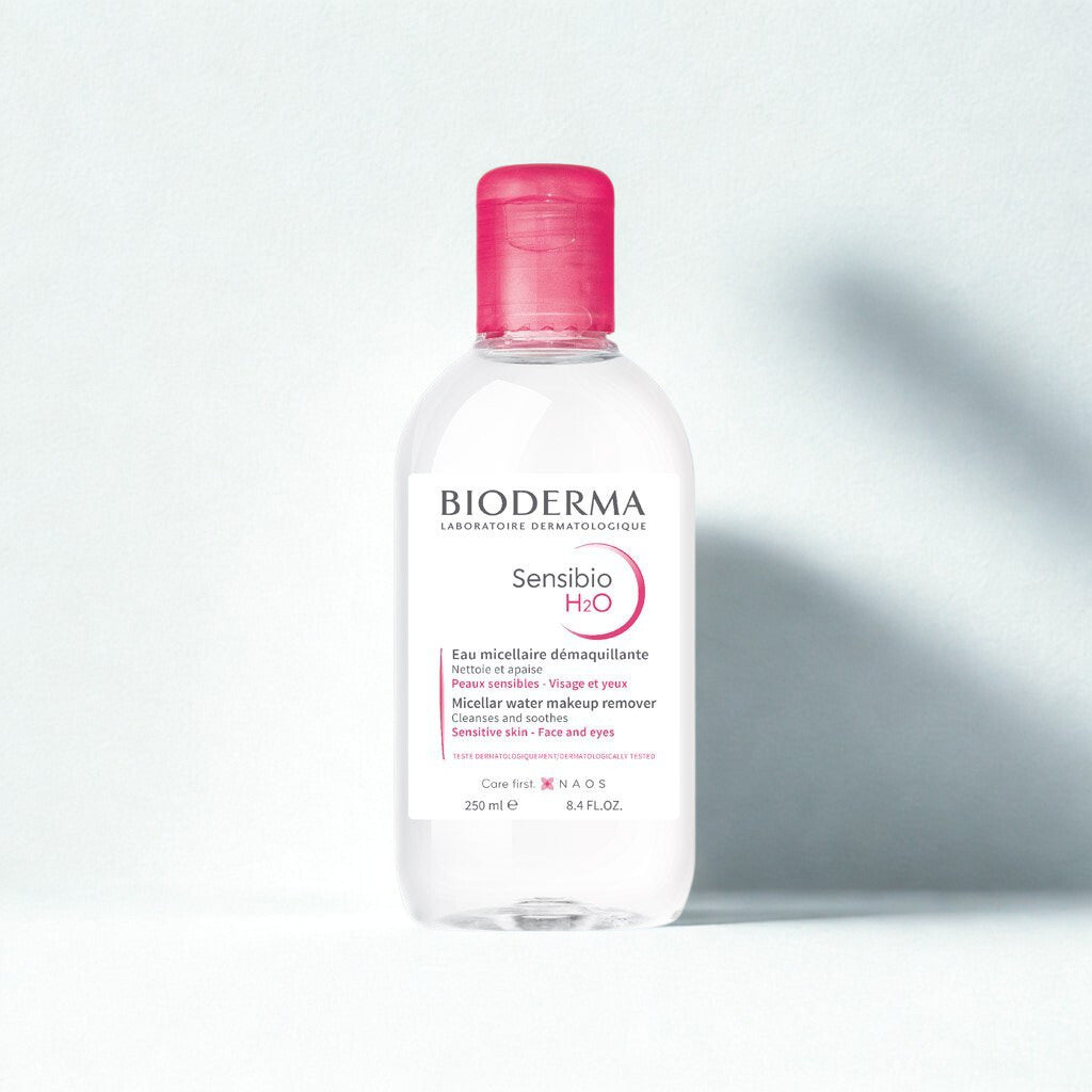 Bioderma Sensibio H2O bottle with pink cap on a light gray background
