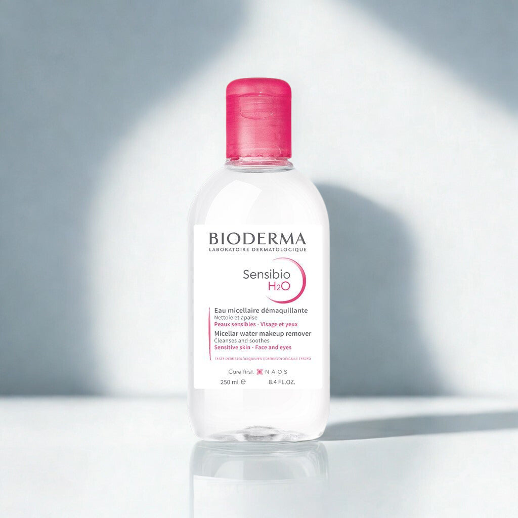 Bioderma Sensibio H2O bottle with pink cap on a light gray background