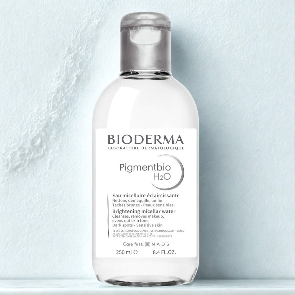 Bioderma bottle of Pigmentbio H2O on a light blue background