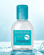 Bioderma micellar water bottle with a blue label on a water-themed background