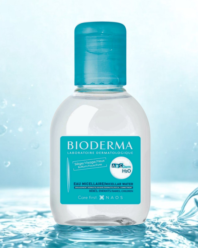 Bioderma micellar water bottle with a blue label on a water-themed background