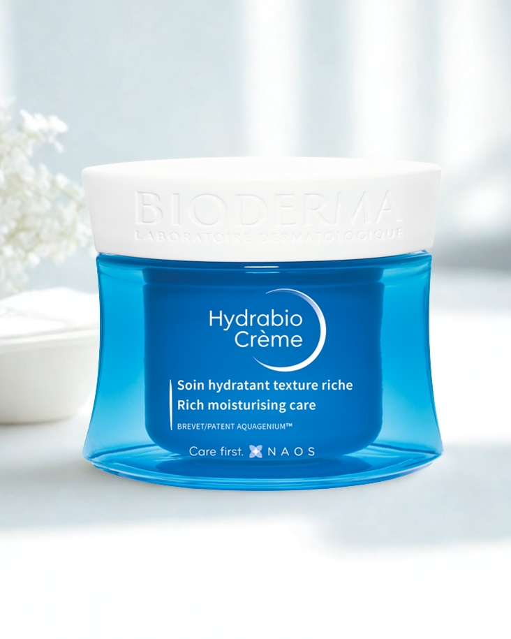 Blue jar of Hydrabio Creme with white lid on a light background