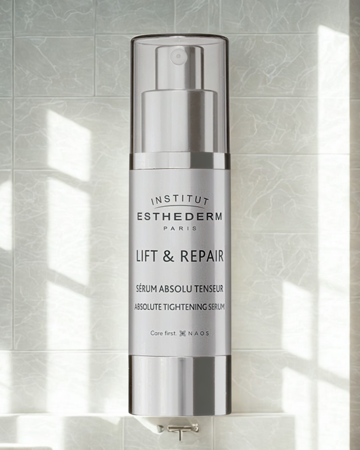 Institut Esthederm Lift & Repair serum bottle on a light gray tiled background
