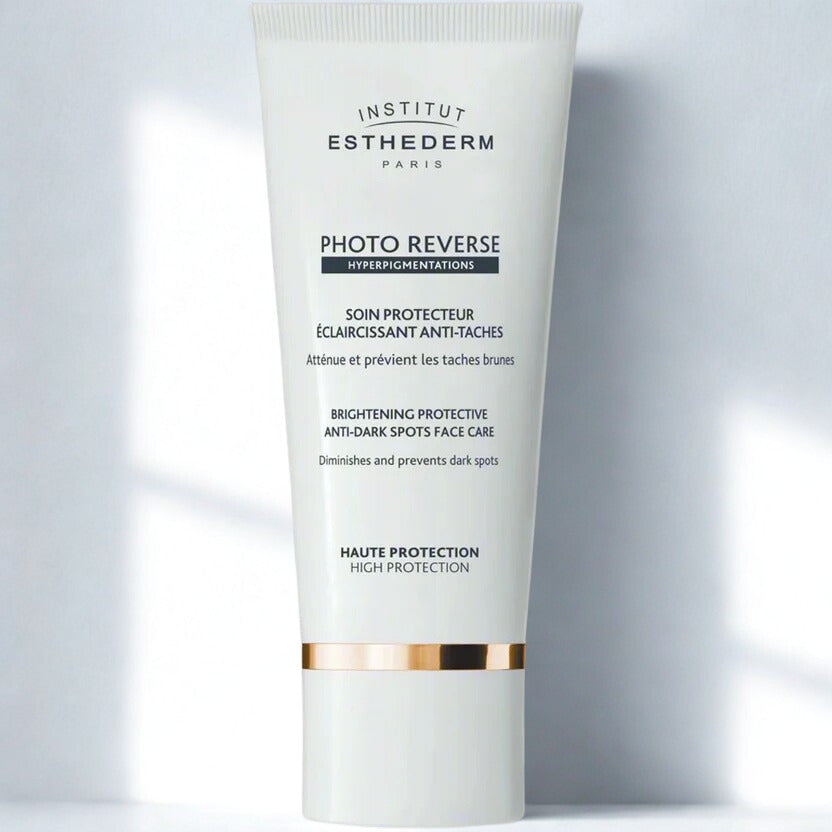Institut Esthederm Photo Reverse skincare tube on a light gray background