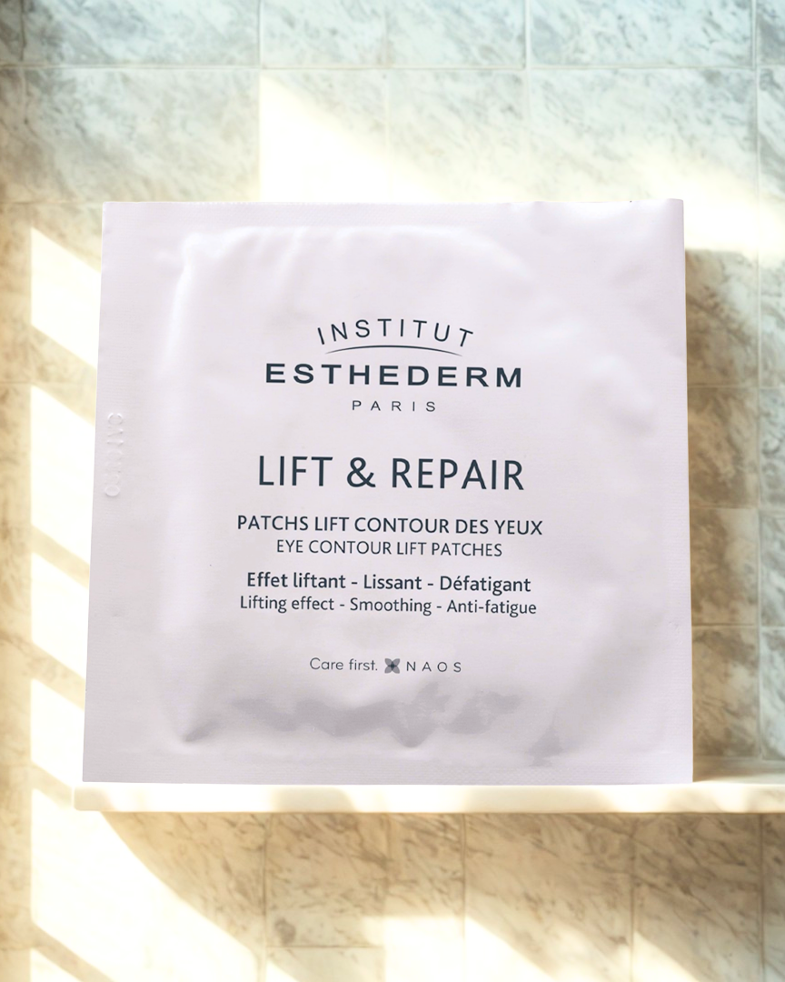 Institut Esthederm eye contour lift patches packaging on a wooden surface